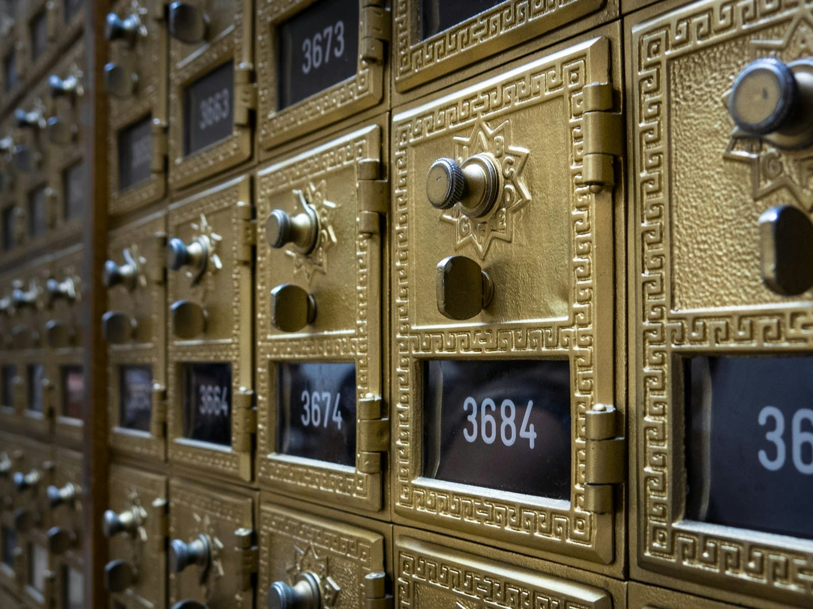 a bunch of mail boxes with numbers on them